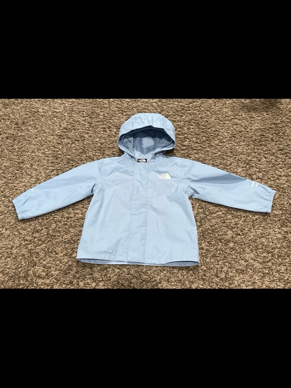 The north face light blue rain jacket, baby size 12 to 18 months